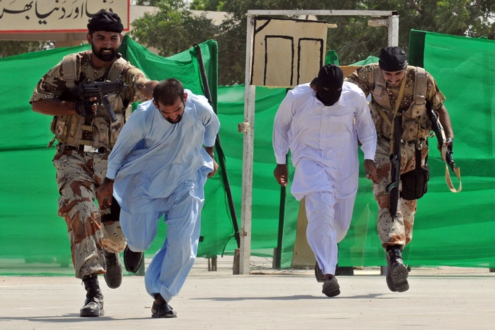 Pakistani paramilitary soldiers capture mock terrorists during an anti-terror drill in Karachi on Sept. 30, 2009. (Rizwan Tabassum/AFP/Getty Images)