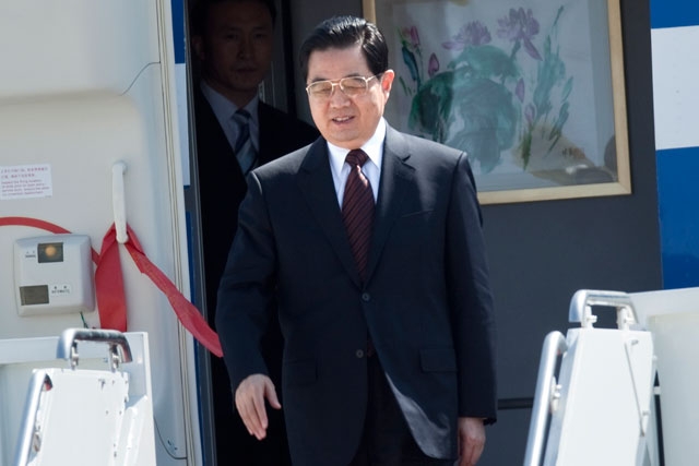 Hu Jintao, President of the People's Republic of China, arrives at Andrews Air Force Base April 12, 2010 in Maryland to attend a Nuclear Security Summit. (Brendan Smialowski/Getty Images)