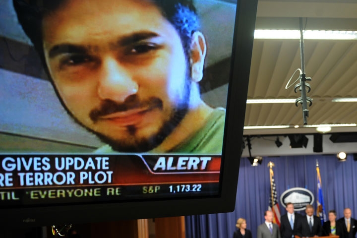 An image of terror suspect Faisal Shahzad is seen on a TV screen as federal and New York City officials hold a briefing on the Times Square attempted bombing, in Washington, DC, on May 4, 2010. (Jewel Samad/AFP/Getty Images)