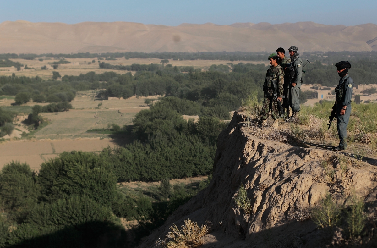 BALA MURGHAB, BADGHIS PROVINCE - JUNE 30: Afghan Army soldiers and National Police members survey a valley from a hill during an early-morning informational mission. (Chris Hondros/Getty Images) 