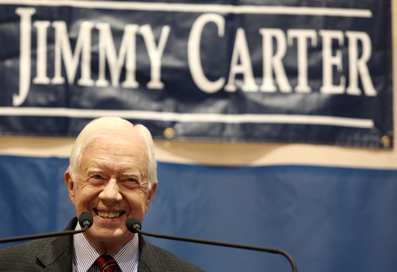 Former President Jimmy Carter smiles at the crowd during his 28th annual town hall meeting in Atlanta, Georgia on September 16, 2009.