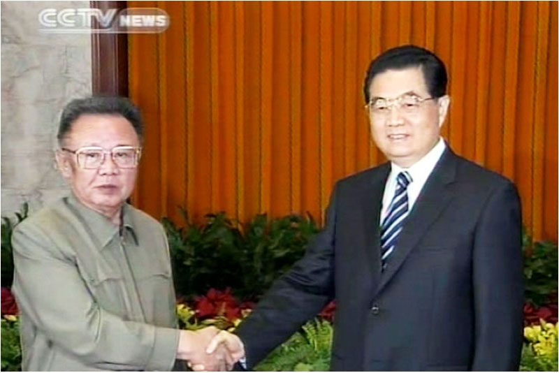 A TV grab from CCTV taken on May 7, 2010 shows Chinese President Hu Jintao (R) shaking hands with North Korean leader Kim Jong-Il in Beijing on May 7. (STR/AFP/Getty Images)