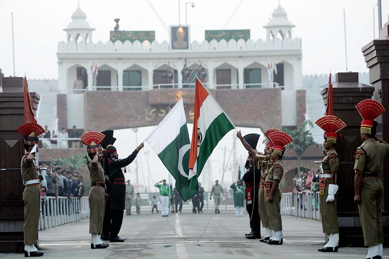 Pakistani Rangers (in black) and Indian Border Security Force personnel perform the daily retreat ceremony on the India-Pakistan border at Wagah in Dec. 2008. (Narinder Nanu/AFP/Getty Images) 