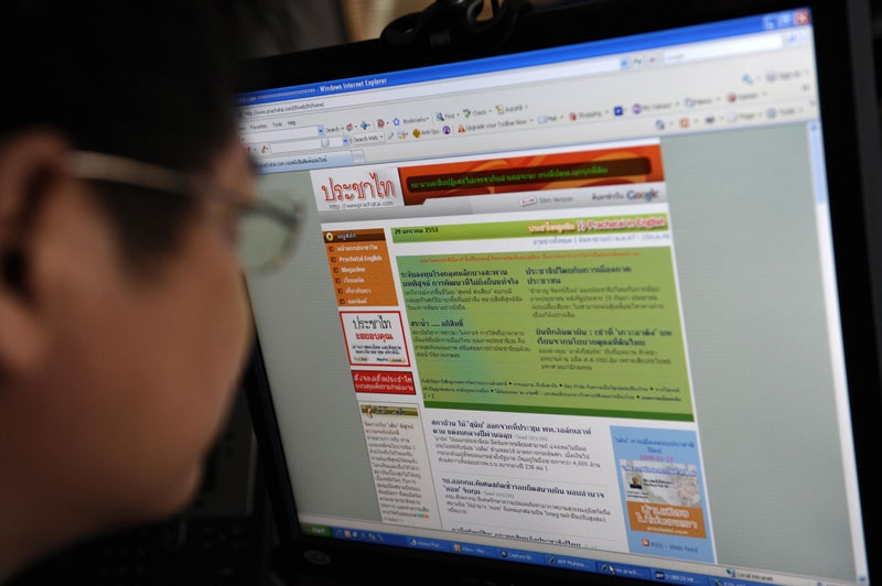 A Thai office worker looks at prachatai.com in Bangkok on Jan. 28, 2009. Frustrated with what she saw as corporate influence and political bias in Thailand's print media, Chiranuch Premchaiporn helped launch a news website in 2004 to try and filter out the spin. (AFP/AFP/Getty Images)