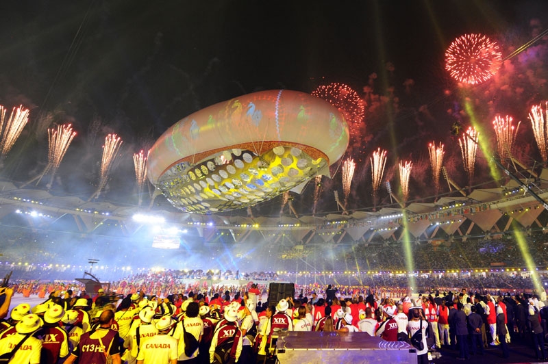 Fireworks light up the sky as performers dance underneath the aerostat during the XIX Commonwealth Games opening ceremony at the Jawaharlal Nehru Stadium in New Delhi on October 3, 2010. (William West/AFP/Getty Images) 