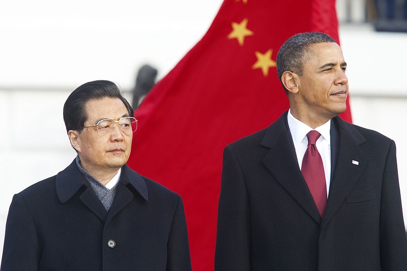 US President Barack Obama stands with Chinese President Hu Jintao (L) during a State Arrival ceremony on the South Lawn of the White House in Washington, DC, on Jan. 19, 2011. (Paul J. Richards/AFP/Getty Images)