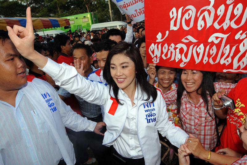 Pheu Thai candidate Yingluck Shinawatra greets supporters in Chiang Rai province on May 22, 2011. Shinawatra and her party went on to win a decisive victory in Thailand's elections on July 3. (Pornchai Kittiwongsakul/AFP/Getty Images)