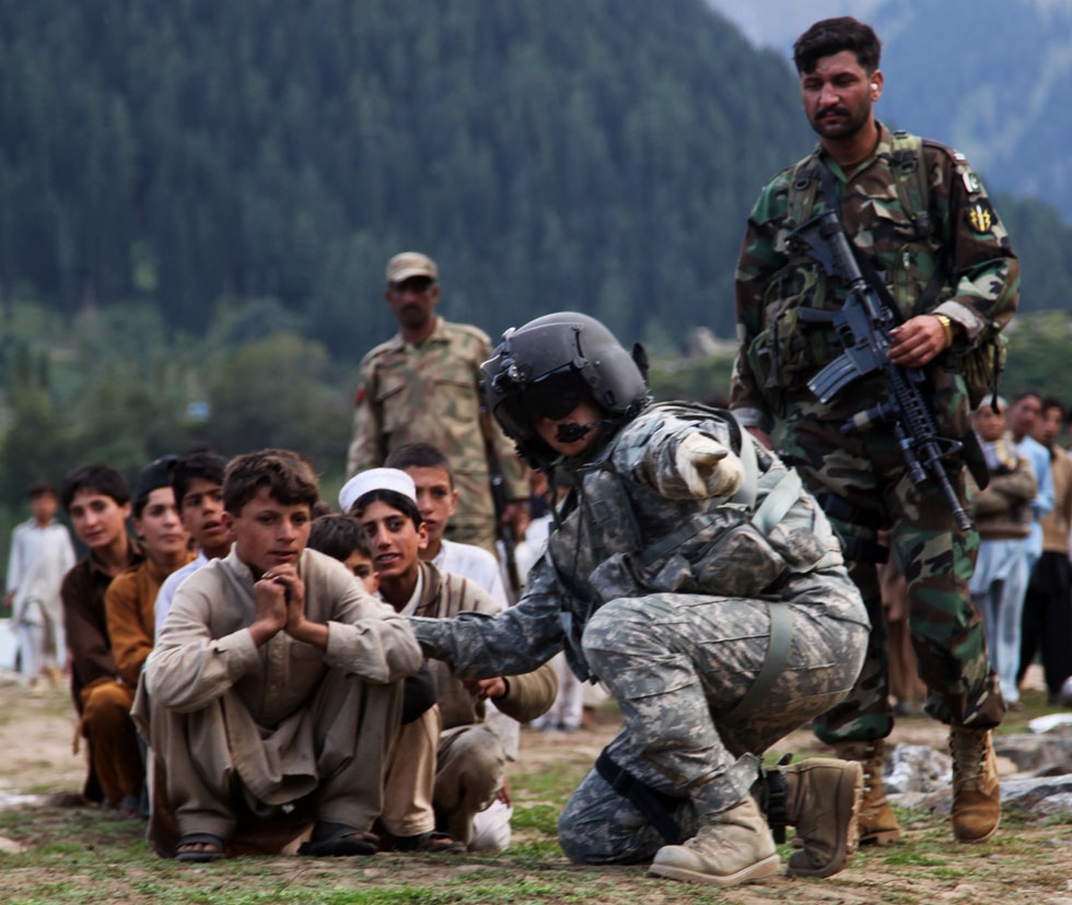 Local Pakistani kids await to be evacuated on a CH-60 Blackhawk in Khyber - Pakhtunkhwa, Pakistan, on Sept. 13, 2010. Photo By Joshua Kruger. (Flickr/DVIDSHUB)