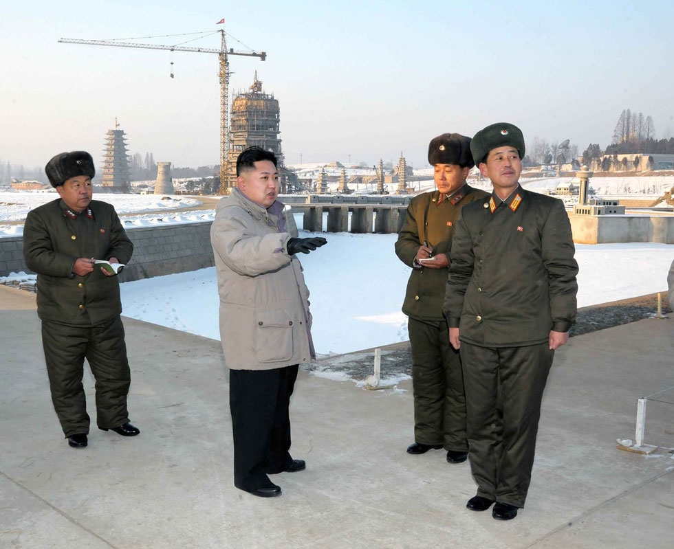 This undated picture, released from North Korea's official Korean Central News Agency on January 12, 2012 shows North Korean leader Kim Jong Un (C) inspecting the planned construction site for the Pyongyang Folk Park, undertaken by Korean People's Army service personnels in Pyongyang. (KNS/KCNA/AFP/Getty Images)