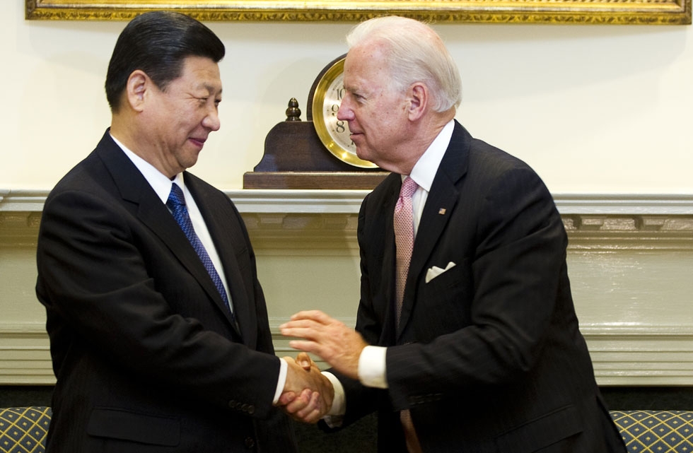 US Vice President Joe Biden (R) shakes hands with Chinese Vice President Xi Jinping in the Roosevelt Room at the White House in Washington, DC, February 14, 2012. (Jim Watson/AFP/Getty Images)