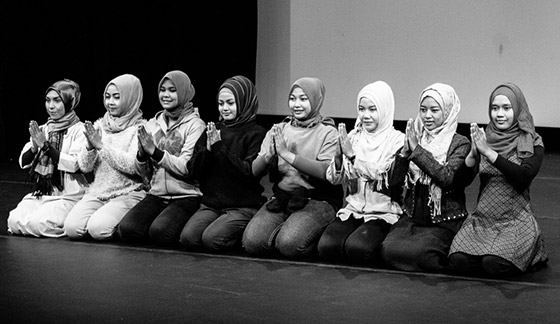 The Tari Aceh troupe performing a sitting dance at the workshop. (Vaishali Nayak)