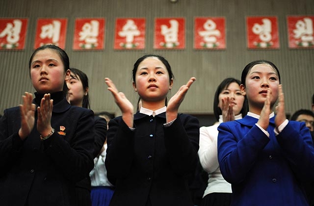 A group of North Korean teenagers clap as they watch a performance in Pyongyang.