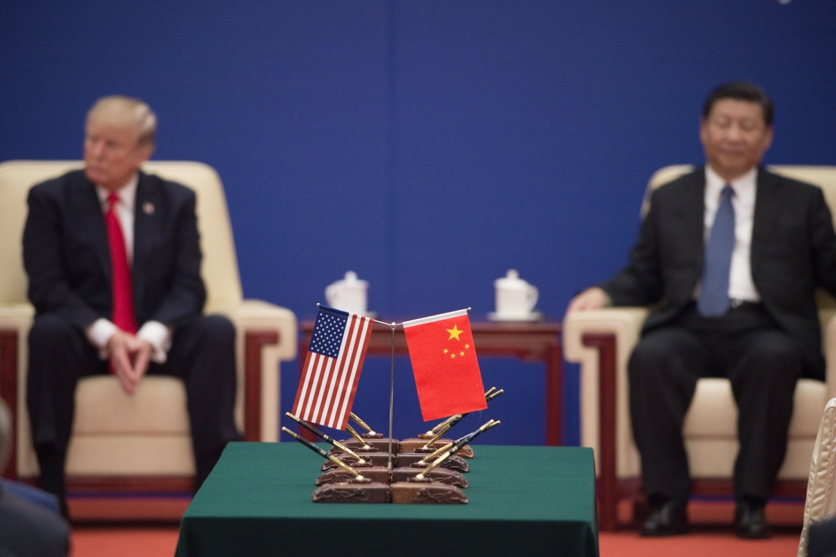 US China flags with Xi Jinping and Trump in background