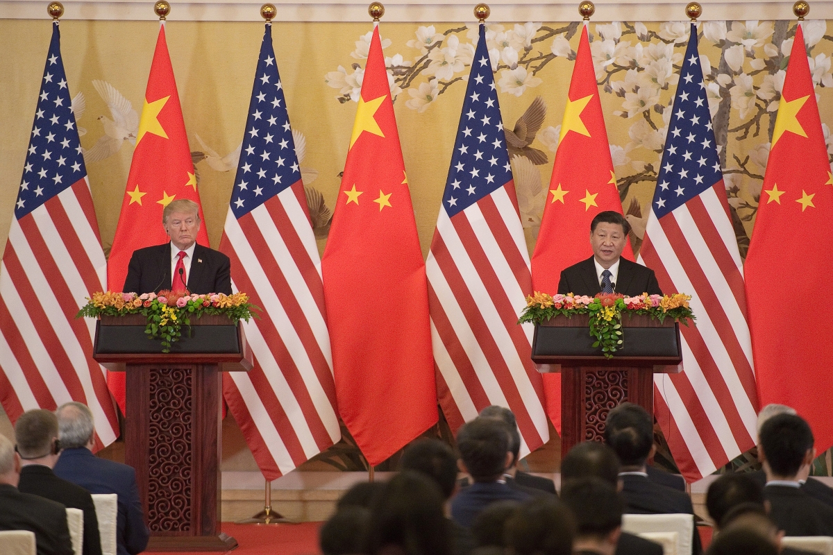 US President Donald Trump (L) and China's President Xi Jinping speak during a joint statement in Beijing on November 9, 2017.