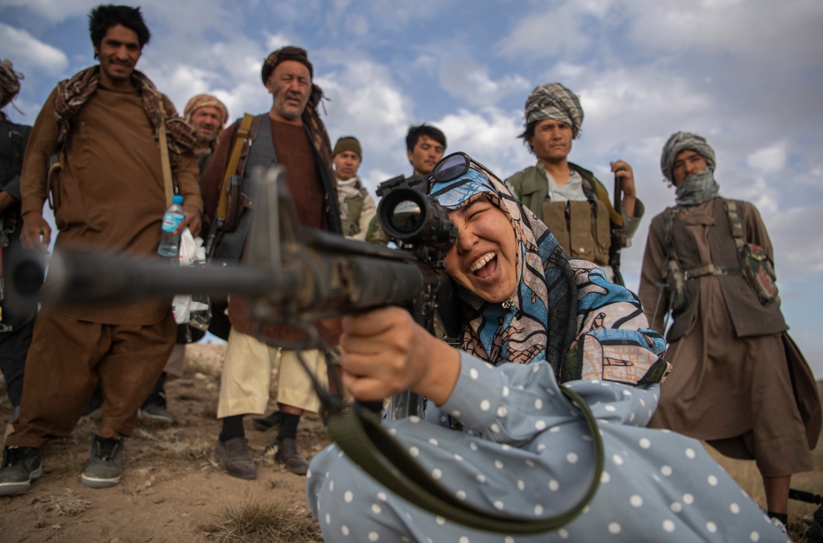 Charkint Governor Salima Mazari, one of Afghanistan’s highest ranking female politicians ever, points a gun as she visits forces in Charkint district, Balkh province on June 29, 2021. She devoted much of her last years in office to repelling Taliban encroachments.