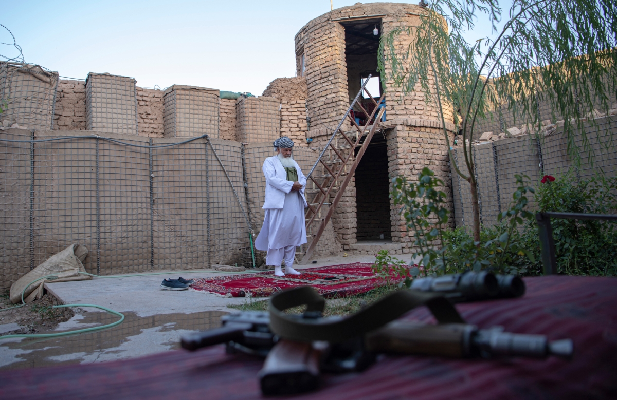Militia leader Ismail Khan prays at his fortified command headquarters during a clash with Taliban insurgents in Herat, Afghanistan, on August 2, 2021. Khan, 75, commanded a 2,000-member civilian militia who fought the Taliban in the absence of regular Afghan security forces.