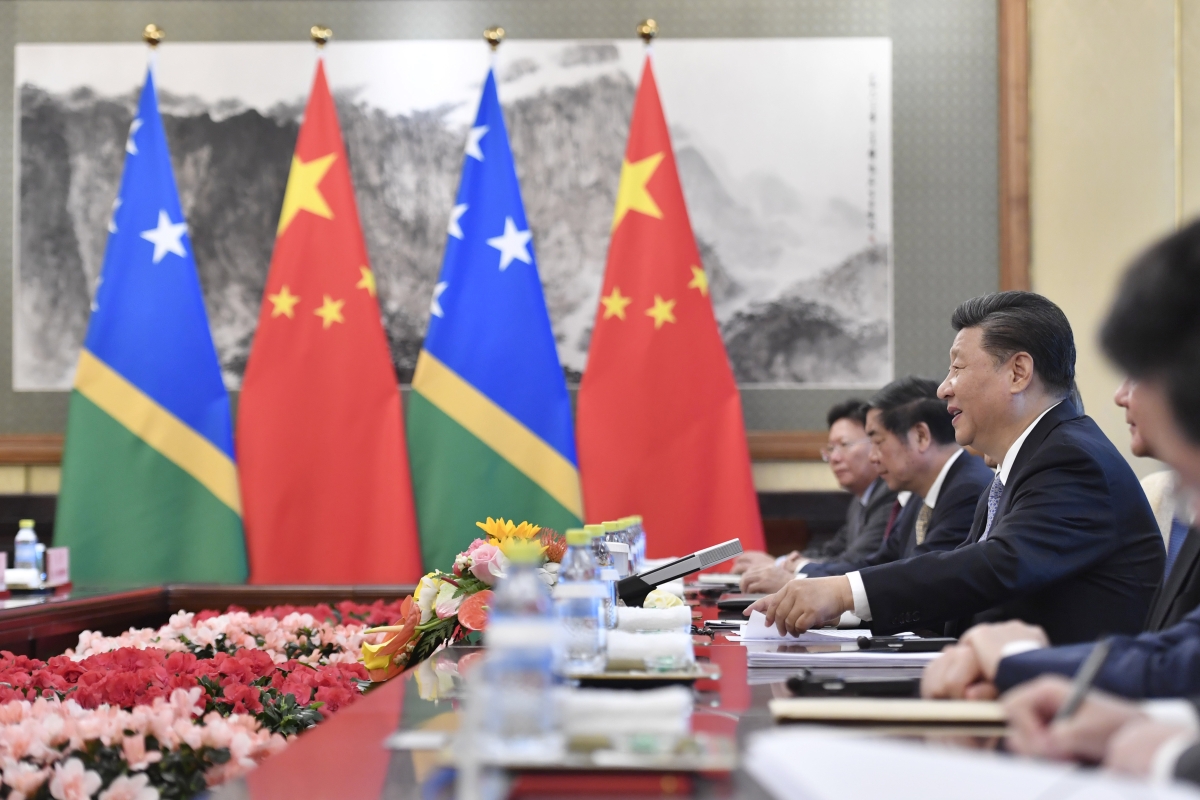 Chinese President Xi Jinping talks to Solomon Islands Prime Minister Manasseh Sogavare (not pictured) during their meeting at the Diaoyutai State Guesthouse in Beijing on October 9, 2019. 