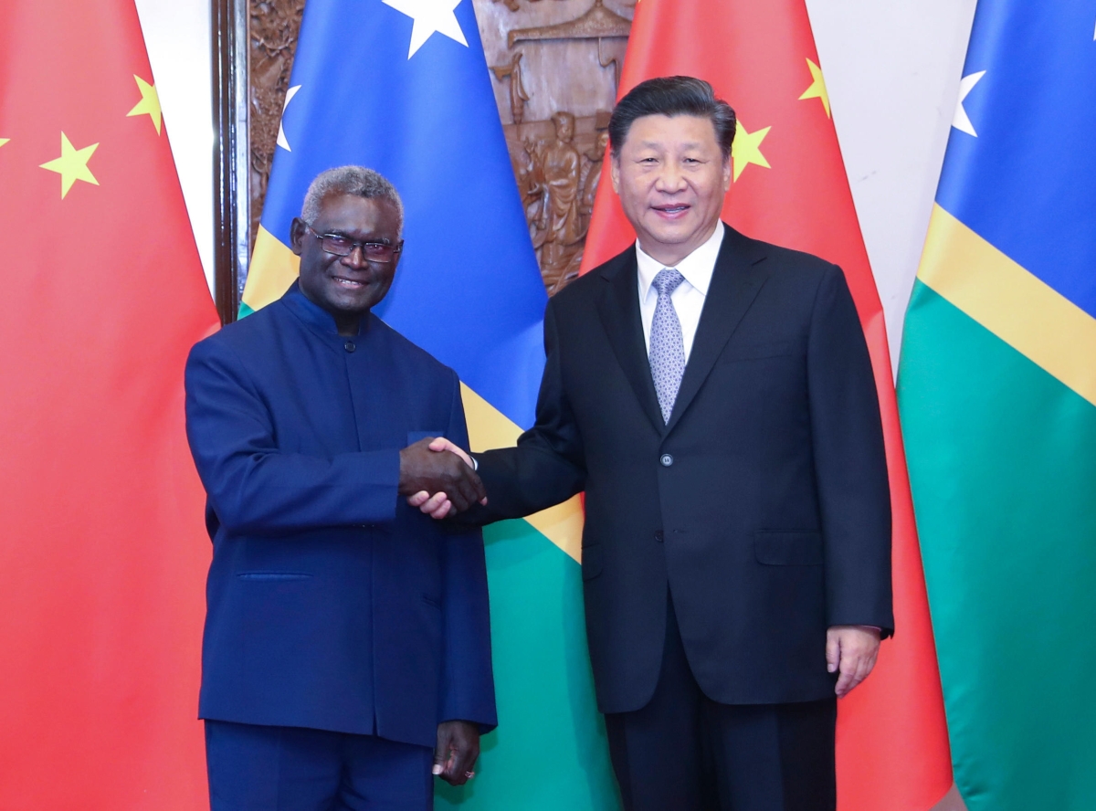 Chinese President Xi Jinping, right, meets with Solomon Islands' Prime Minister Manasseh Sogavare at the Diaoyutai State Guesthouse in Beijing, China, on Oct. 9, 2019.