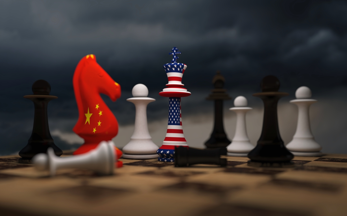 USA and China trade relations, cooperation strategy. US America and China flags on chess king on a chessboard