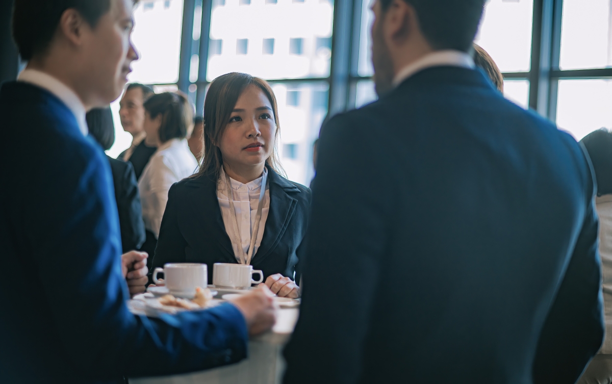 Asian Multiethnic business people talk during a coffee break in Seminar Business conference