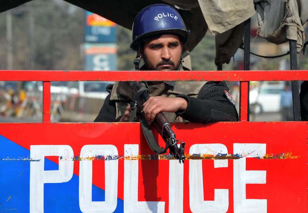 A Pakistani policeman stands guard at a security check point in Lahore, February 2012. (Arif Ali/AFPGetty Images)