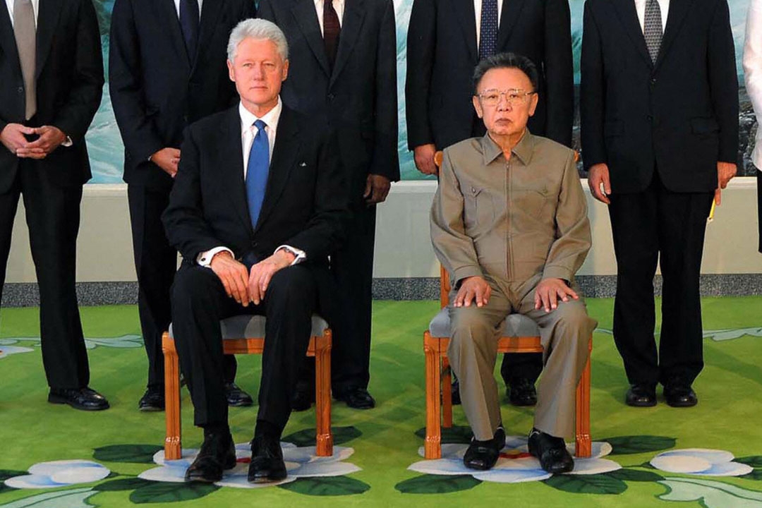 North Korean leader Kim Jong-Il (R) posing with former US president Bill Clinton (L) in Pyongyang after securing a pardon for two US journalists, Clinton's spokesman said. (KNS/AFP/Getty Images)