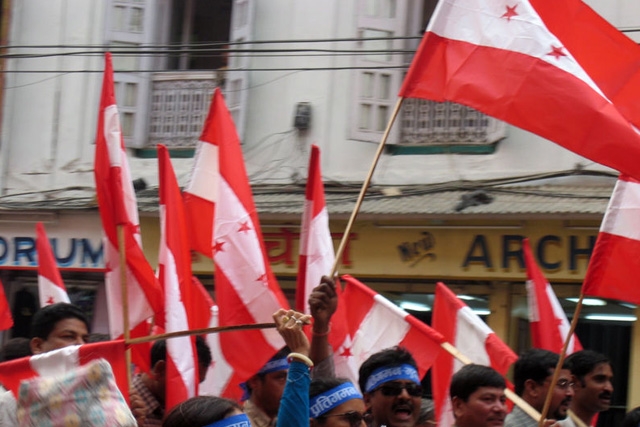 Demonstrators wave flags in Kathmandu, Nepal.