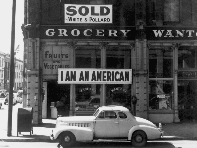 A banner posted by a Japanese American store owner the day after Pearl Harbor.