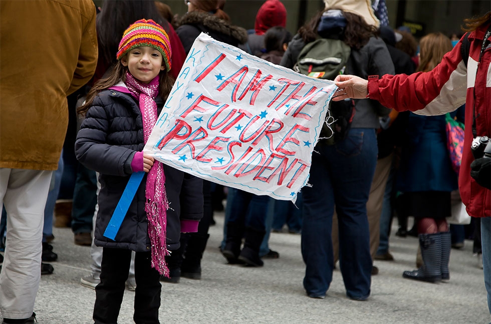 A girl at an immigration rally in Daley Plaza in Chicago (Joseph Mietus/Flickr)