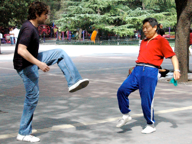 Joshua (left) playing jianzi, a Chinese game similar to hacky sack, in a Beijing park. (Joshua Halpern)