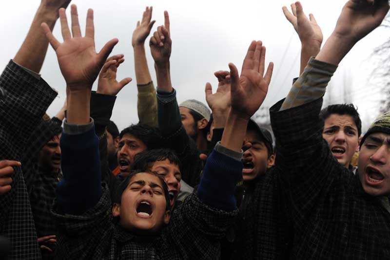 Kashmiris shout anti-India slogans near the body of Zahid Farooq, 17, who died on February 5, 2010 after an altercation broke out between troops and a group of boys in Srinagar.  (Tauseef Mustafa/AFP/Getty Images)