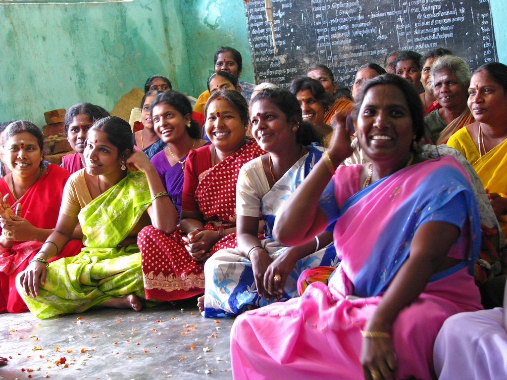 Rural women in their richly coloured saris meeting as members of self-help groups. (mckaysavage/Flickr)