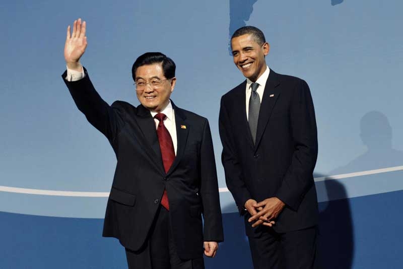U.S. President Barack Obama stands with Chinese President China Hu Jintao (L) at the Pittsburgh G20 Summit in Pittsburgh, Pennsylvania September 24, 2009.  (Philippe Wojazer/AFP/Getty Images)