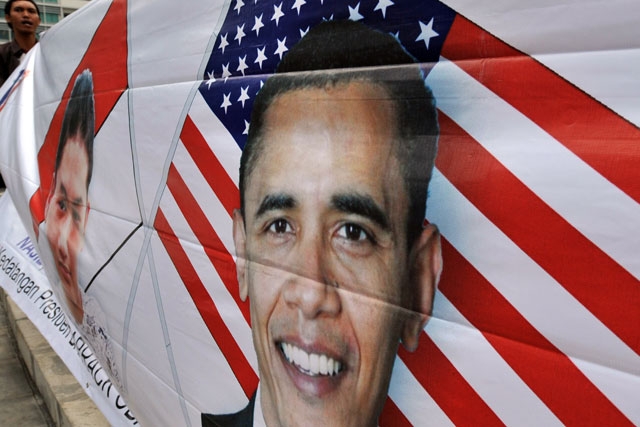 A man holds a banner depicting US President Barack Obama during a pro-Obama rally in Jakarta on March 19, 2010. (Adek Berry/AFP/Getty Images) 
