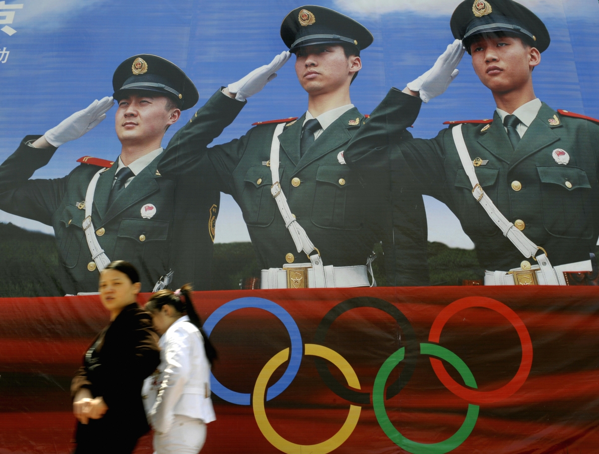 BEIJING, CHINA - MAY 4: Women walk past a Beijing Olympic Games billboard in Beijing. (LIU JIN/AFP/Getty Images)