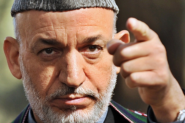 Afghan President Hamid Karzai addresses media representatives at the Presidential palace in Kabul on November 5, 2008. Karzai congratulated Barack Obama on his election victory, saying it took the world to a 'new era.' (Shai Marai/AFP/Getty Images)