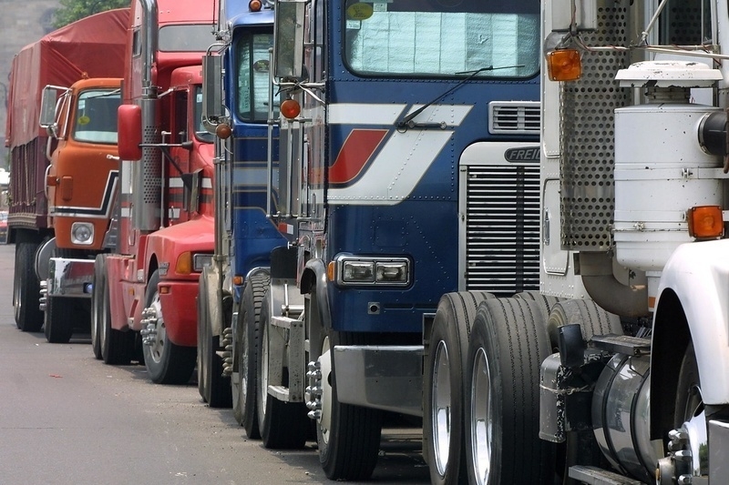 A queue of trucks, similar to those which transport goods inter-state and across national borders, stands 04 August 2001 in Mexico City. (Ramon Cavallo/AFP/Getty Images)