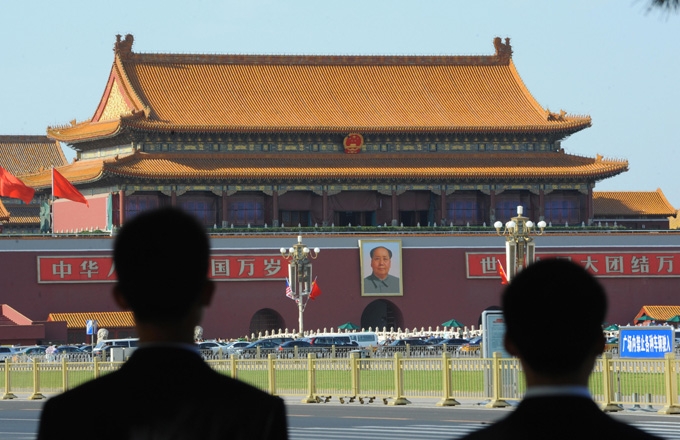 Chinese security watch over Tiananmen Square prior to the welcoming ceremony for Malaysian Prime Minister Najib Razak in Beijing on June 3, 2009. (Goh Chai Hin/AFP/Getty Images)