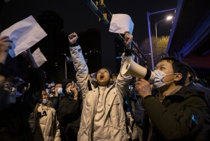 Protesters shout slogans during a protest against Chinas strict zero COVID measures on November 28, 2022 in Beijing, China