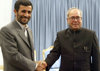 Iranian President Mahmoud Ahmadinejad shakes hands with Indian Foreign Minister Pranab Mukherjee during a meeting on February 7, 2007 to discuss a gas pipeline from oil- and gas-rich Iran to energy-starved India. (AFP/Getty Images)