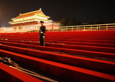 A guard stands on the temporary reviewing stand built for the National Day celebration on Tiananmen Square on Sept. 28, 2009 in Beijing. (Feng Li/Getty Images)