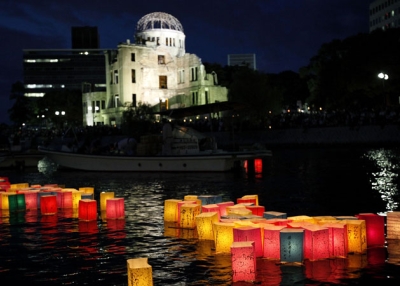 Paper lanterns are released onto the Motoyasu River to commemorate the atomic bomb victims and pray for world peace beside the A-Bomb Dome on August 6, 2010 in Hiroshima, Japan, on the day of the 65th anniversary of the Hiroshima atomic bombing. (Kiyoshi Ota/Getty Images)