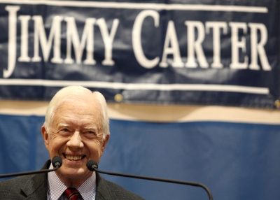 Former President Jimmy Carter smiles at the crowd during his 28th annual town hall meeting in Atlanta, Georgia on September 16, 2009.