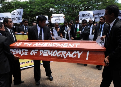 Sri Lankan lawyers carry a makeshift coffin during a protest in Colombo on September 7, 2010 against a draft bill of the constitution that is being rushed through parliament on an urgent basis. (Ishara S. Kodikara/AFP/Getty Images)