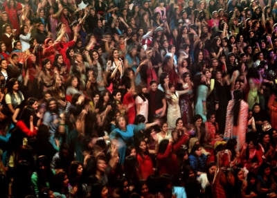 Pakistani female students enjoy the performance of the band Overload during a concert in Kinnaird women's college in Lahore on Feb. 6, 2010. (Behrouz Mehri/AFP/Getty Images)