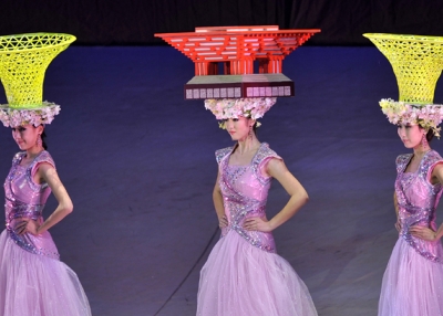 Performers parade with hats shaped as pavilions during the closing ceremony of the the World Expo 2010 in Shanghai on October 31, 2010 (PHILIPPE LOPEZ/AFP/Getty Images)