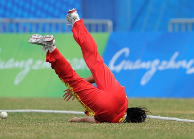 Yu Miao of China stops the ball from reaching the boundary during the women's group pool