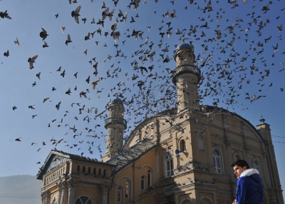 An Afghan man is pictured during Eid al-Adha prayers at the Shah-e Do Shamshira mosque in Kabul on November 16, 2010.