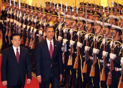 Visiting US President Barack Obama walks beside Chinese President Hu Jintao (L) during the honor guard welcoming ceremony at the Great Hall of the People in Beijing on Nov. 17, 2009. (Frederic J. Brown/AFP/Getty Images)