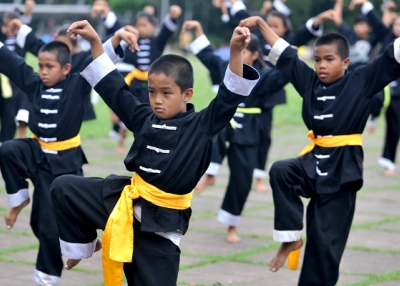 Children practice Kung Fu in an impoverished area of Quezon City, suburban Manila, on January 23, 2011. The activity, run by a group called ArKuTaiPA (a combination of Arnis, Kung-Fu, Tai Chi, Philippine Association) teaches martial arts to children from six to 18 years-old in an effort to promote self-discipline. (Noel Celis /AFP/Getty Images)